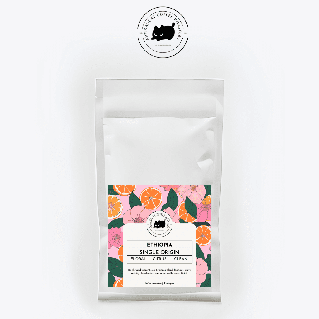 Ethiopia coffee bag. The label shows pink blossoms, orange slices and green leaves.